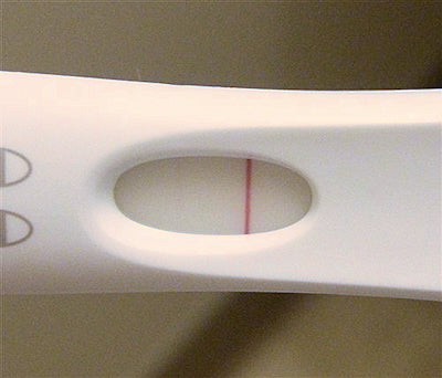 Pregnancy test with potential evaporation line.