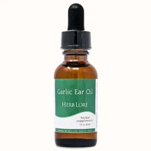 1 oz amber glass bottle of Herb Lore Garlic Ear Oil with a green and white label and dropper top