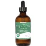 Brown glass bottle of Herb Lore Organic Pregnancy Tea Tincture with dropper top and green label indicating USDA Organic and alcohol-free.