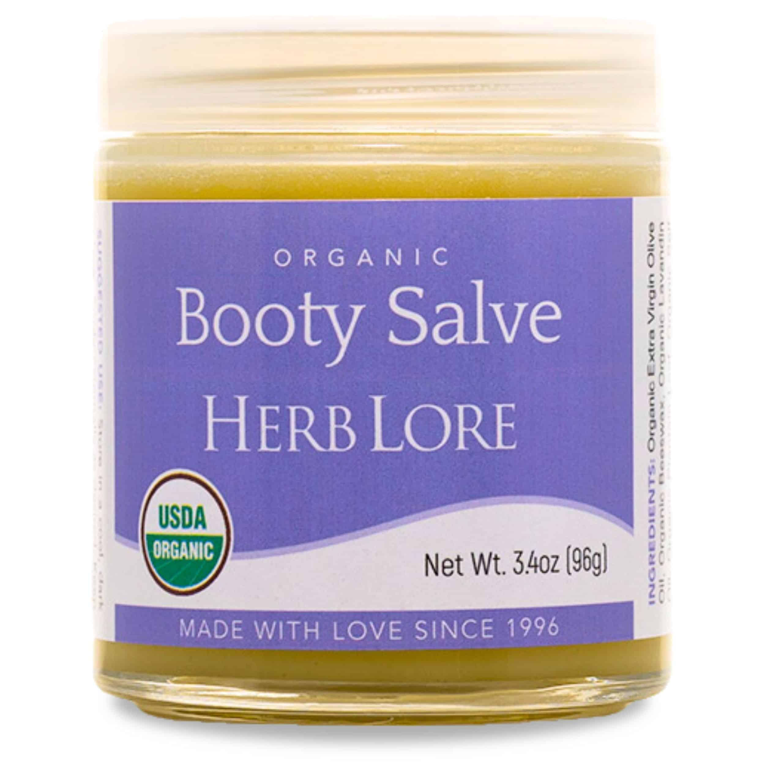Large 3.4 oz jar of Herb Lore Organic Booty Salve with purple label and white lid