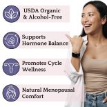 Woman smiling and pointing to health benefits of Vitex tincture: USDA Organic, hormone balance, cycle wellness, and menopausal comfort