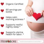 Pregnant woman holding a red heart over her belly beside a list of benefits of Pregnancy Tea Tincture, including support for morning sickness, sleep, and uterine health.