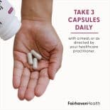 Three FertilAid for Women capsules in a woman's hand with text: Take 3 capsules daily with a meal or as directed.