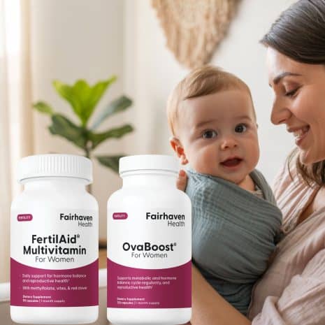 FAWOvaLifetyle Smiling mother holding her baby with bottles of FertilAid and OvaBoost for Women by Fairhaven Health in the foreground.