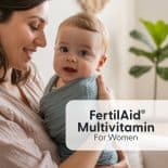 Smiling mother holding baby in a cozy home setting with FertilAid Multivitamin for Women text overlay.
