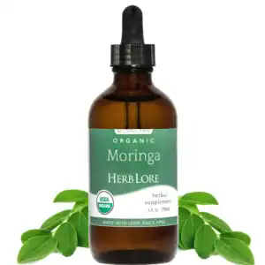 Bottle of Herb Lore Organic Moringa Tincture with moringa leaves on white background